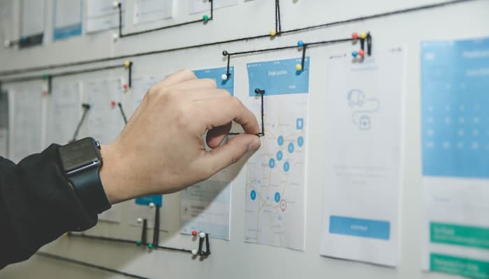 A migration sequence planned out on a wall of cards