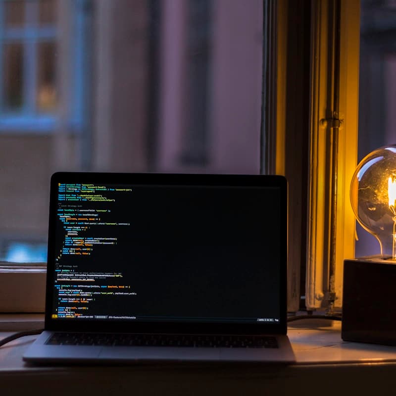 Two engineers working at a shared screen